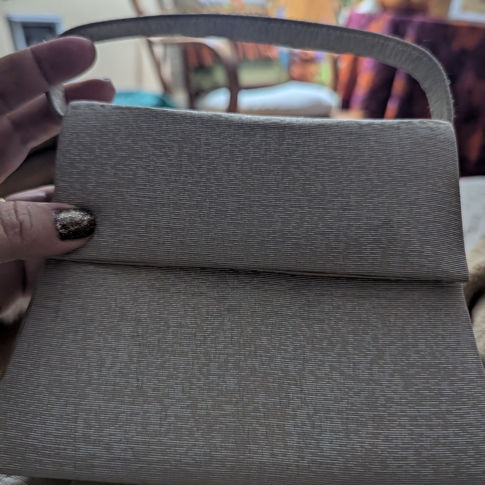 Elegant Silver Women's Clutch. Snap Closure. Optional Cross Body Strap.